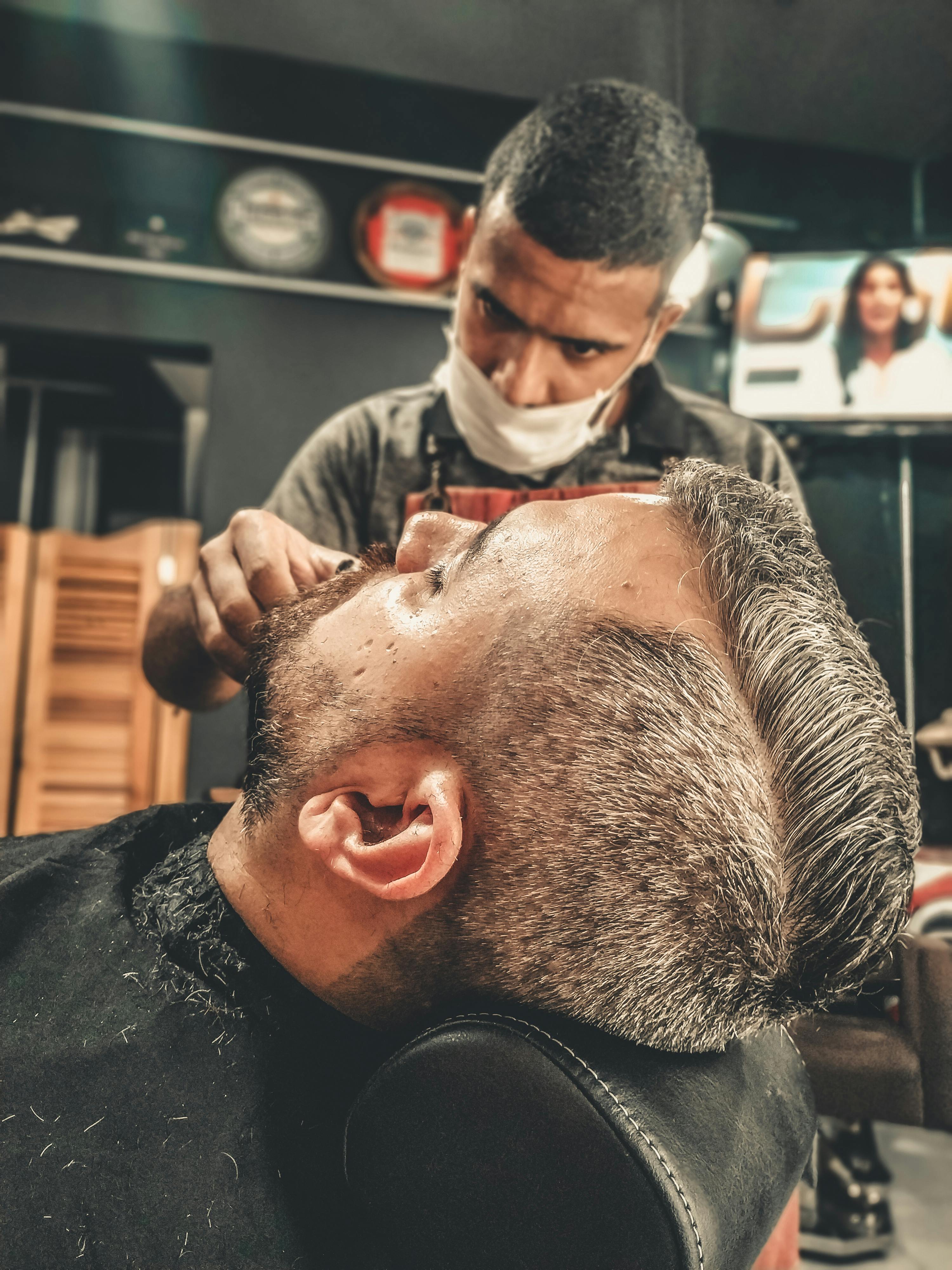 barbers cutting hair